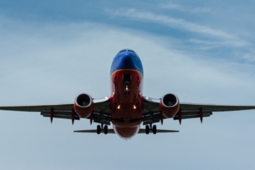 blue and red airplane on sky