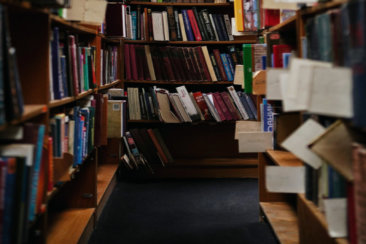 books on brown wooden shelf