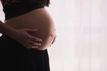 woman holding stomach