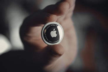 person holding black and white round ornament