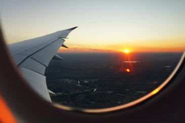 airplanes window view of sky during golden hour