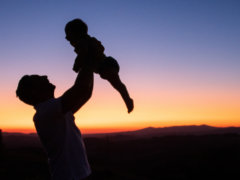 silhouette of man and woman kissing during sunset