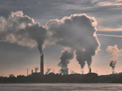 silhouette of building under white clouds during daytime