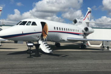 white airliner on gray pavement