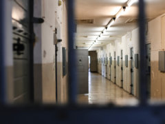 a long hallway with a bunch of lockers in it