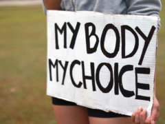 a person holding a sign