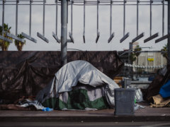 a pile of garbage sitting on the side of a road