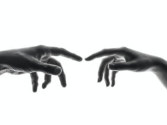 two person's connecting fingers