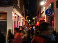 people walking on street during nighttime