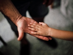 Father and Child's Hands Together