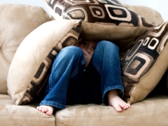 Kid hiding on Pillows