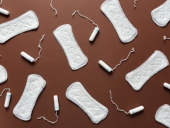 Sanitary Napkins and Tampons on the Brown Background