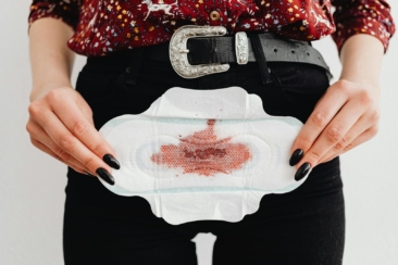 Close-Up Shot of a Person Holding a Sanitary Napkin