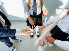 Children in School Uniform Playing Rock Paper Scissors