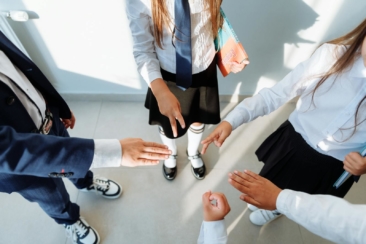 Children in School Uniform Playing Rock Paper Scissors