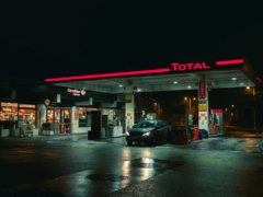 cars parked in front of store during night time