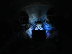 boy playing at laptop inside room