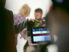 person holding clapperboard